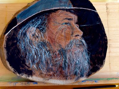 Man in akubra water colour on wood
