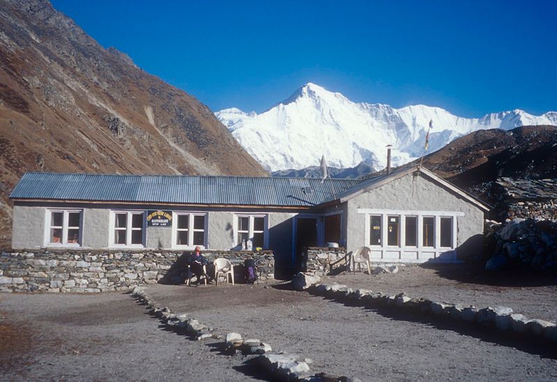 Martina sitting outside our Gokyo lodge with Cho Oyo summit behind