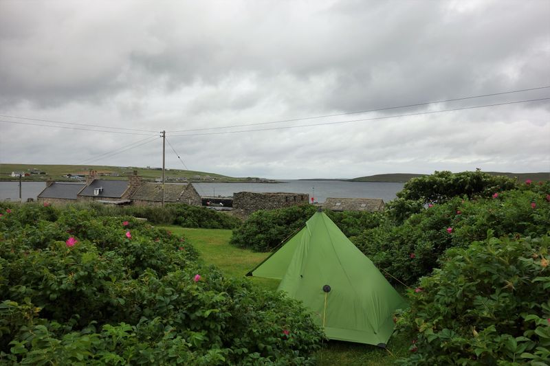 July 22 Martina bikepacking on Shetland, Unst- sheltering from the wind