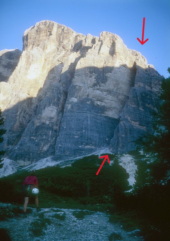 Dolomites - Approaching Tofana south face and 'South Arete' route on right (red arrows)