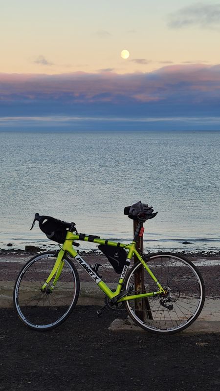 Nov 24 Still road biking in good weather with moon behind