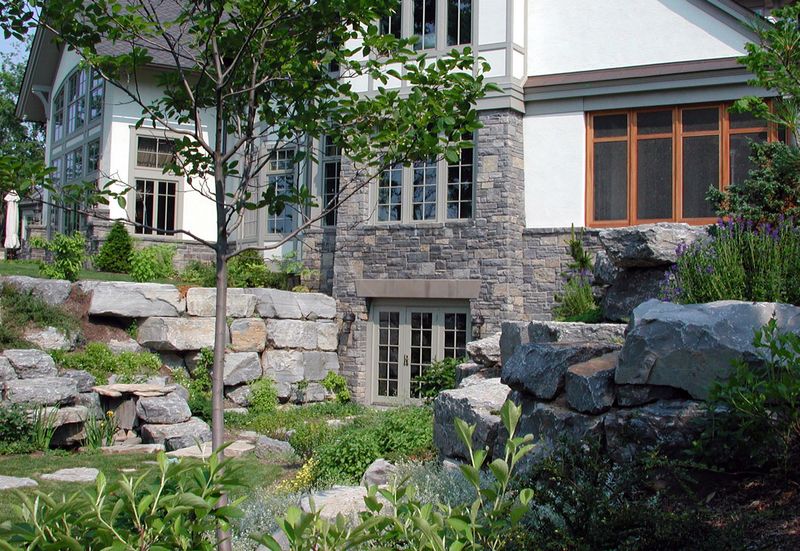 walkout with big rock retaining wall.jpg
