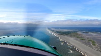 Kodi Bear Kodiak 100 flying along coast to Yakutat airport, Yakutat, Alaska 674  