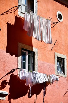 Hanging the White Laundry on Rua de Santa Cruz do Castelo, Lisbon Portugal