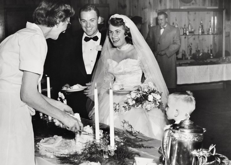 176) Ed helping dish up cake.