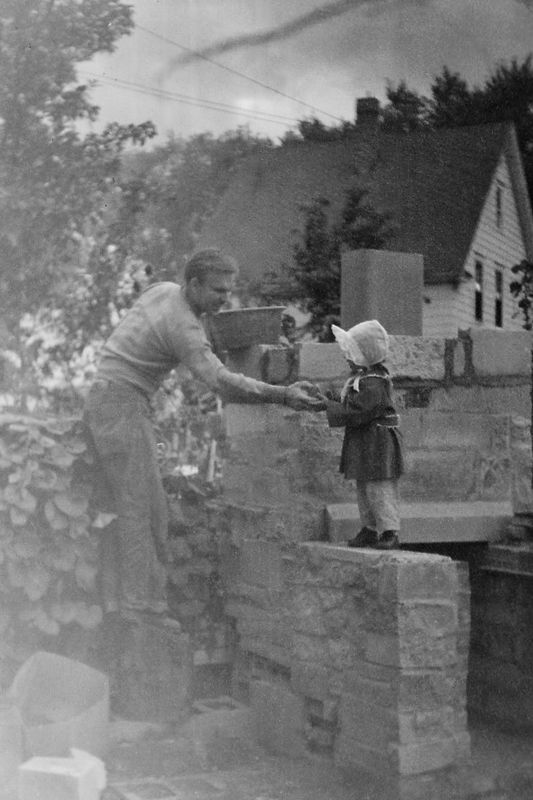 260) Susie helping Ray build a fireplace.