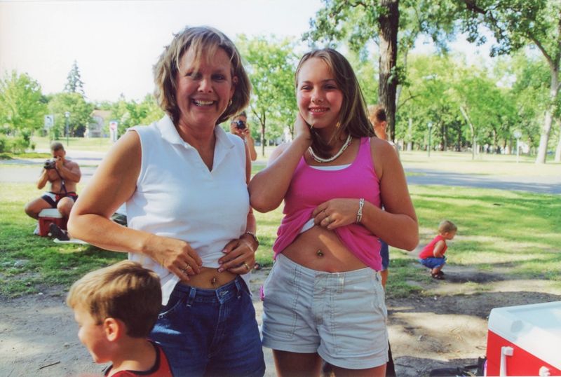 90) Lynn and Alex sporting new belly piercings.