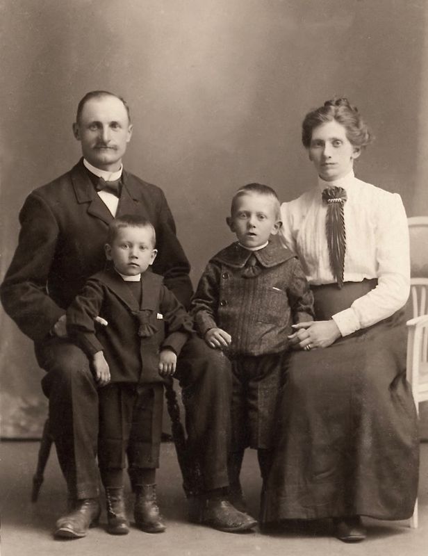 94) David Karlson and wife Teresia and sons Sven and Bertil.