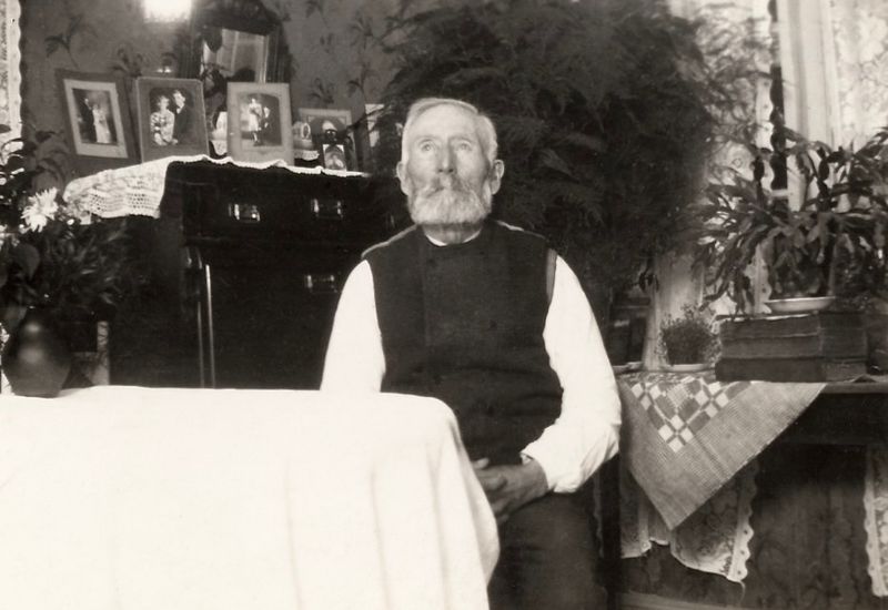 157) Johan August Karlsson (notice the pictures behind him)