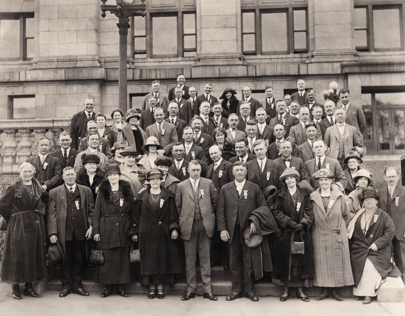 390) Fritz front row with coat over his arm