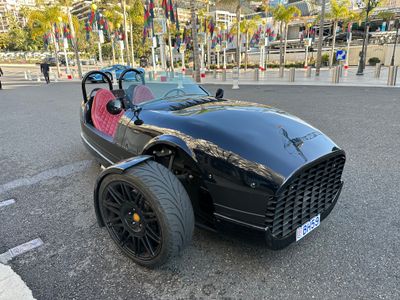 Dark Car in a Bright Seaside Town