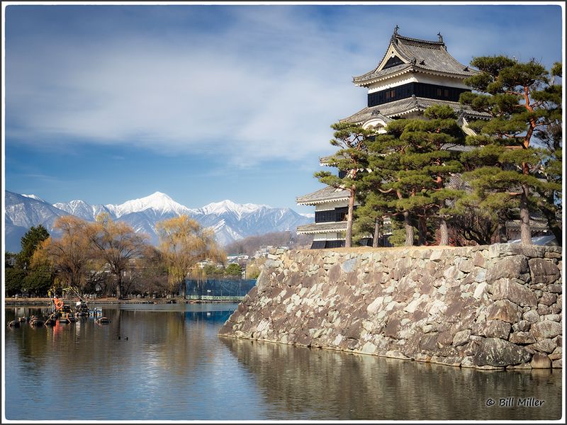 Castle and Snow Covered Mountains