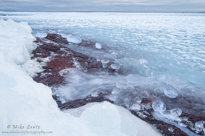 Icy boulder shoreline 