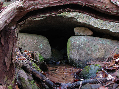 A runnel framed by stone and wood