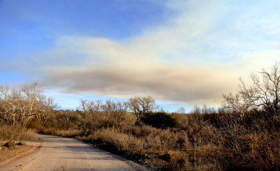 Arizona campground dirt road with smoke plume