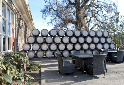 stacked wine barrels on patio