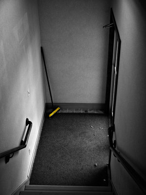 Yellow broom in corner.