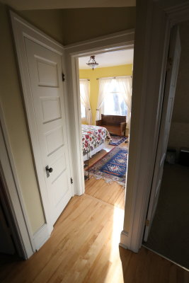 top of stairs looking into main 2nd floor bedroom