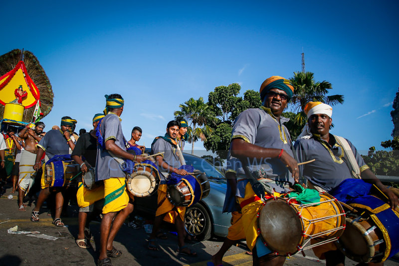 The urumi melam drums band accompany devotees on their walk