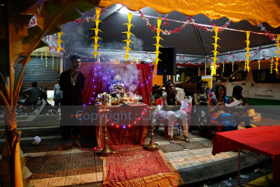 Devotees line the streets waiting for the procession