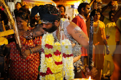 Performing rituals in preparation for the walk up Batu Caves