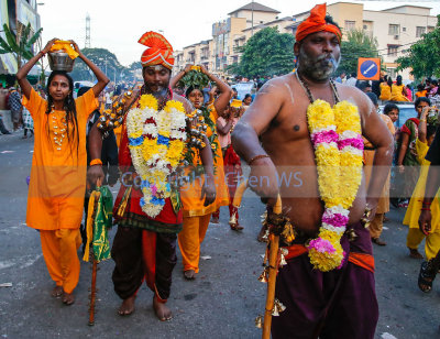 Devotees walking towards the temple from the riverside after the cleansing ceremony