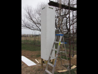 There is a space between the insulation board and the exterior siding. To allow air to flow through the space, I cut out a space at the top of each exterior panel.