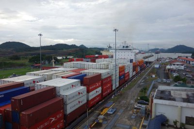 A huge container ship comes through the locks