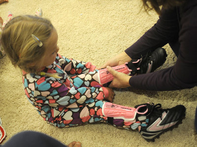 Kristina tries on her new soccer gear