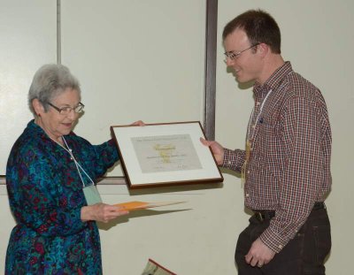 Jay Fitzsimmons receiving Member-of-the-Year Award, from Fenja