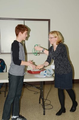 Carlos receiving prize from Holly for his Macoun Club exhibit