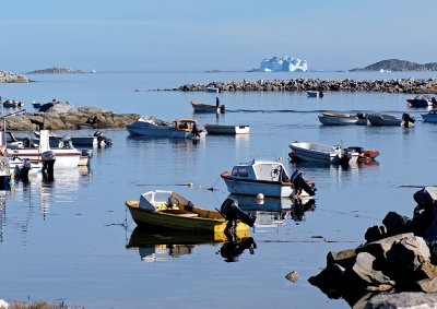 Aasiaat harbour with iceberg