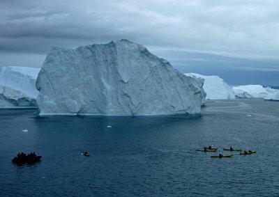 The kayaks sail on