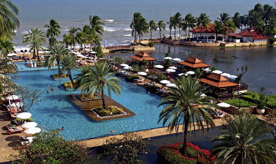 The pool, the palms, and the sea