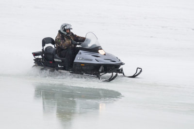 Snowmobile along the shore of the Moose River 2013 April 16th.