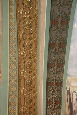 Ornamental bands in central arch over central mural 