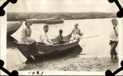 My grandfather at the oar, great grandmother and uncle at the stern