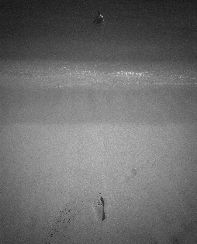 Foot Prints On A Beach