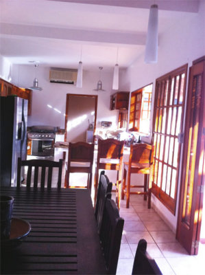 kitchen and dining room- french doors opened to patio making it an indoor-outdoor space