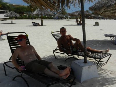 Rusty and Terry relaxing on the beach, Aruba