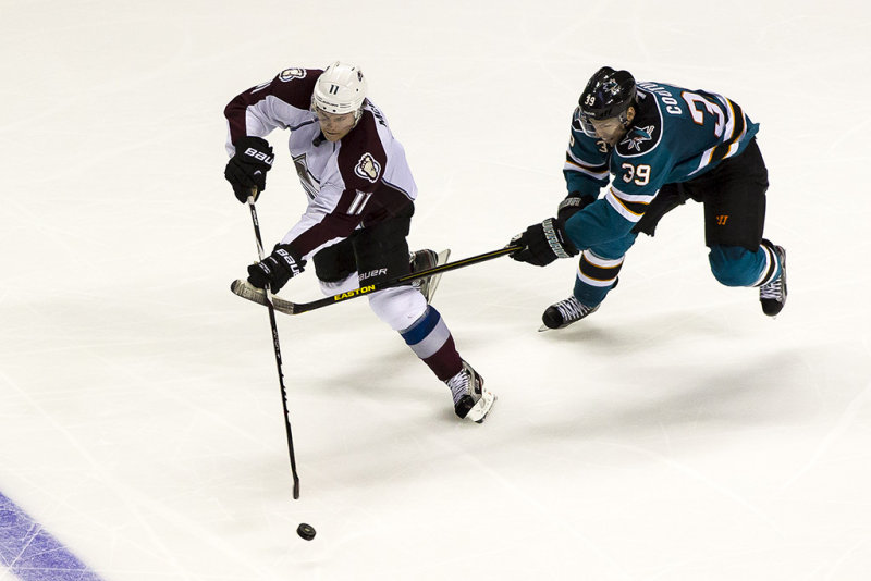 1/26/2013  Logan Couture trying to lift the stick of Jamie McGinn