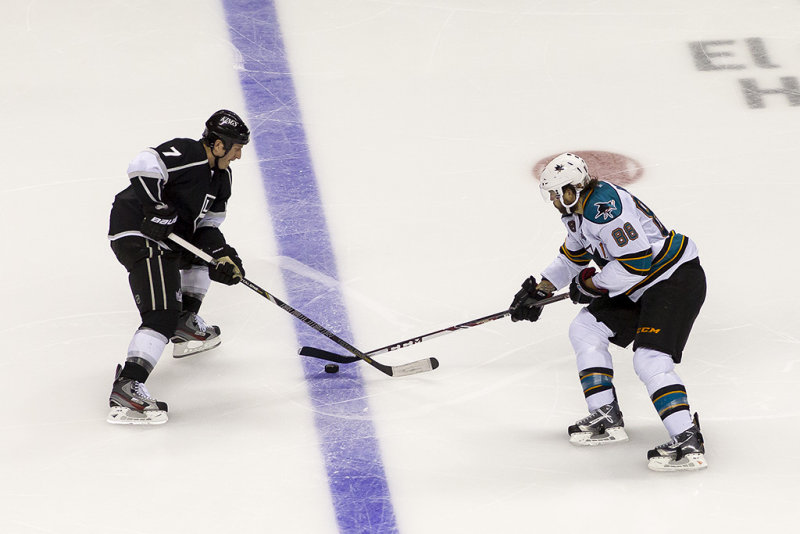 Rob Scuderi stops Brent Burns at the blue line  