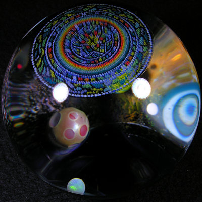 Several planets, an opal moon, a vortex and many other features can bee seen as you spin it.