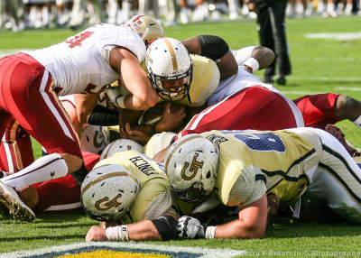 Jackets QB Washington dives over his blockers for a one yard score