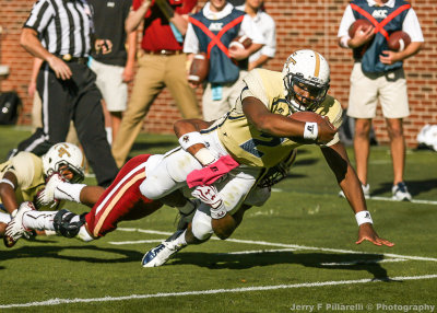 …Jackets QB Lee drags an Eagles defender into the end zone