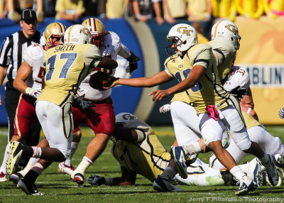 Jackets QB Washington hands off to A-back Smith