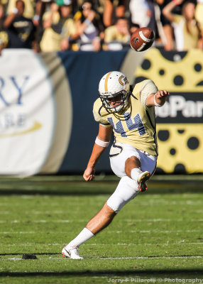 Yellow Jackets K David Scully kicks off after a score