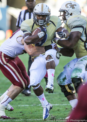 Georgia Tech A-back Zenon is stopped by a Boston College defender