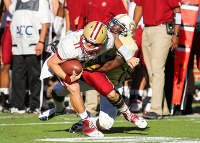 Georgia Tech LB Brandon Watts wraps up BC QB Rettig along the sidelines