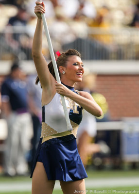 Yellow Jackets Flag Team Member entertains the crowd during pregame festivities
